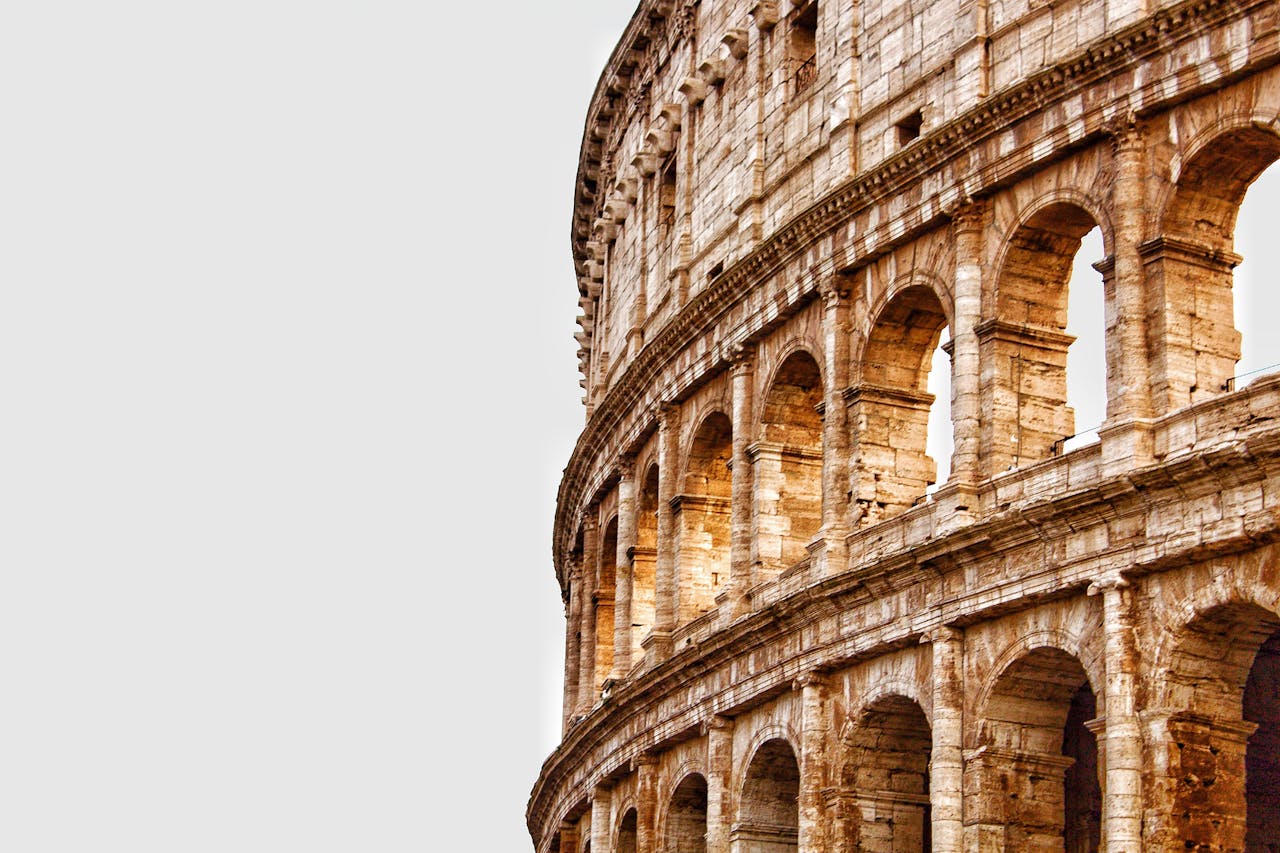 Detailed view of the Colosseum's arches in Rome, showcasing ancient Roman architecture.